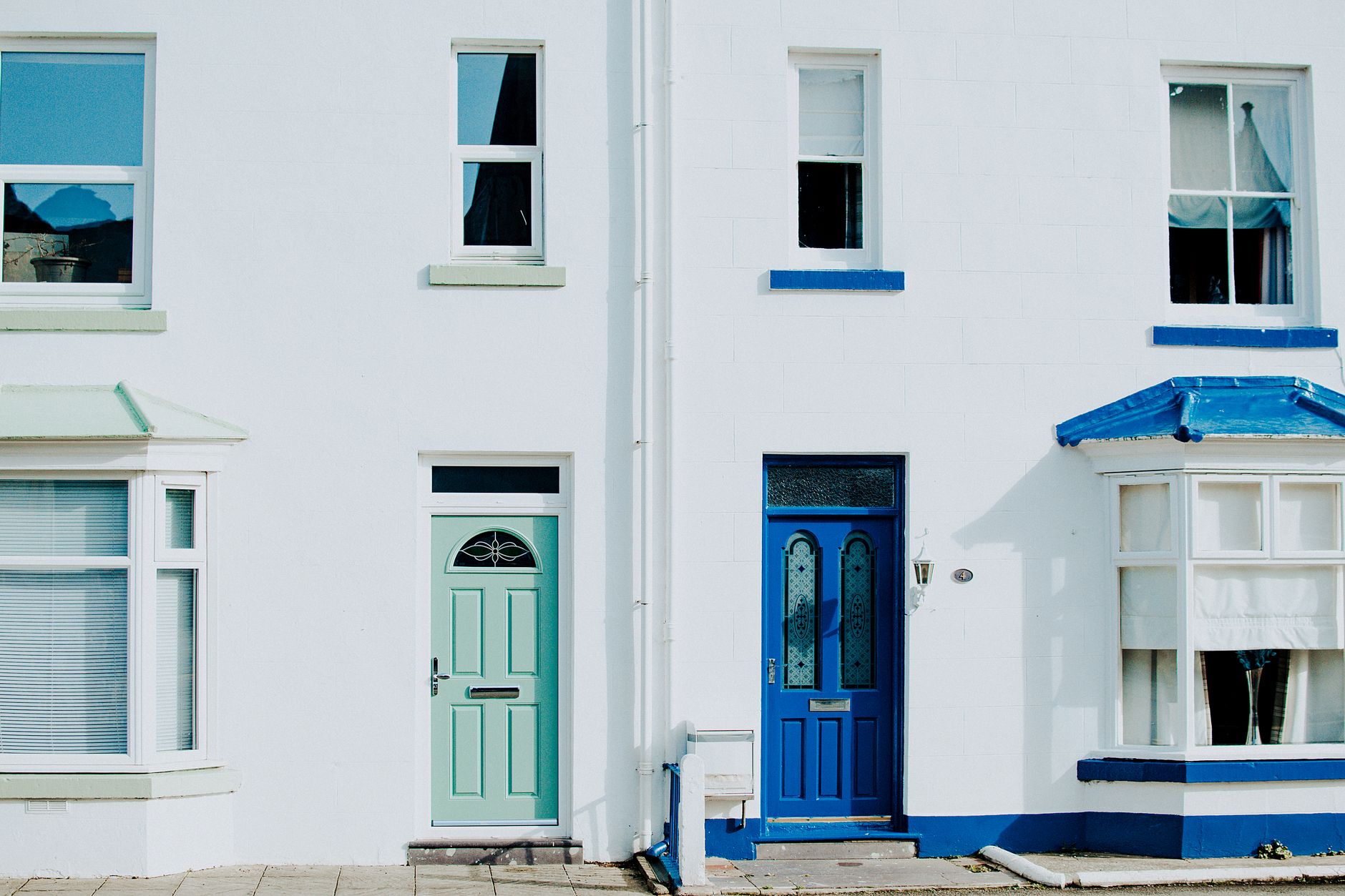 Residential house front door with keyless entry lock in daylight