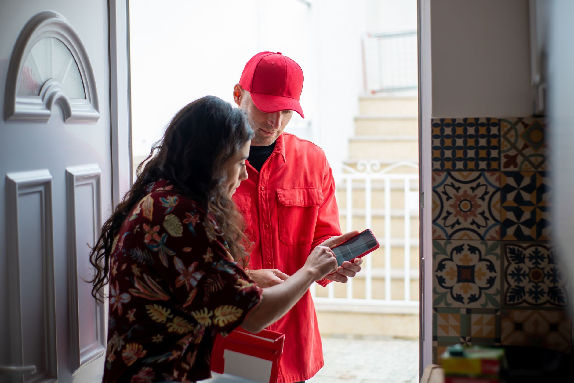 Delivery handoff at a front door secured with a keypad smart lock and guest access code